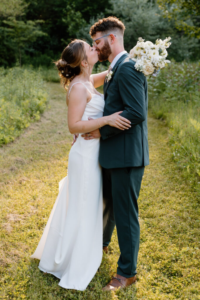 Couple kissing after wedding in Lake George NY
